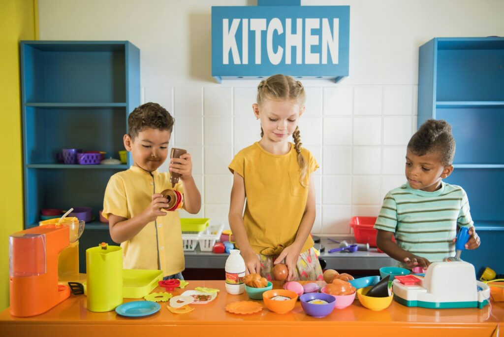 Kids playing with plastic food at daycare.