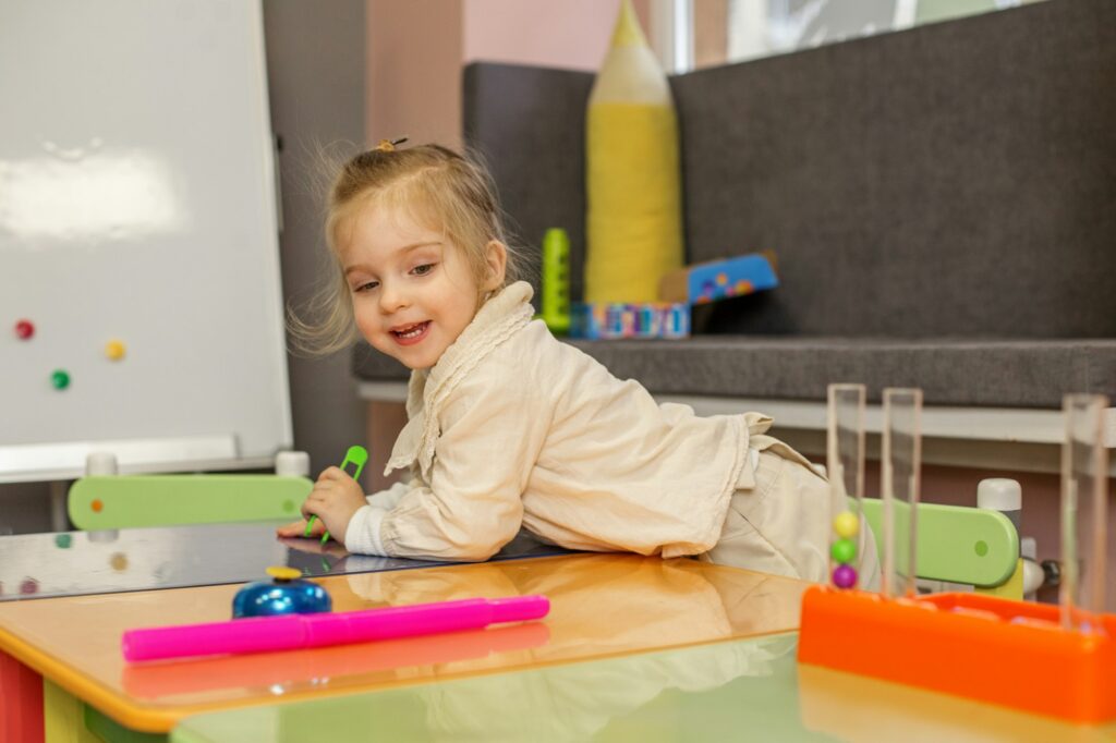 Preschool Girl Engaged with Educational Toys